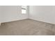 Bright bedroom with neutral carpet and a window providing natural light at 191 Bottle Brush Dr, Haines City, FL 33844