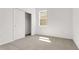 Cozy bedroom with neutral carpet, a window, and a closet at 191 Bottle Brush Dr, Haines City, FL 33844