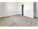 Clean bedroom featuring neutral carpet and a closet and door for storage at 191 Bottle Brush Dr, Haines City, FL 33844