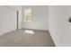 Cozy bedroom with neutral carpet, a window, and a closet at 191 Bottle Brush Dr, Haines City, FL 33844