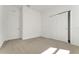 Cozy bedroom with neutral carpet, a window, and a closet at 191 Bottle Brush Dr, Haines City, FL 33844