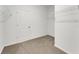 Walk in closet with shelves, racks, and comfortable carpeting at 191 Bottle Brush Dr, Haines City, FL 33844