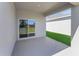Covered patio with sliding glass doors to the home, perfect for entertaining at 191 Bottle Brush Dr, Haines City, FL 33844