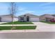 Charming single-story home with a well-manicured lawn and neutral color palette at 191 Bottle Brush Dr, Haines City, FL 33844