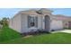 Charming single-story home featuring a well-maintained lawn and a grey color scheme at 191 Bottle Brush Dr, Haines City, FL 33844
