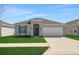 Charming single-story home features a well-manicured lawn and attached two-car garage at 191 Bottle Brush Dr, Haines City, FL 33844