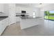 Spacious kitchen boasts a center island, stainless appliances, and an open layout with a large window at 191 Bottle Brush Dr, Haines City, FL 33844