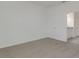 Bright bedroom with plush carpeting, a full closet, and an ensuite bathroom at 207 Bottle Brush Dr, Haines City, FL 33844