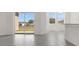 Bright living space featuring tile floors and sliding glass doors to the backyard at 207 Bottle Brush Dr, Haines City, FL 33844