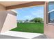 Covered patio showcasing the spacious backyard, perfect for outdoor relaxation at 207 Bottle Brush Dr, Haines City, FL 33844