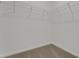 Walk-in closet featuring wire shelving, neutral carpet and white walls at 207 Bottle Brush Dr, Haines City, FL 33844