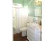 Charming bathroom with white vanity and mint green walls at 2360 Park Forest Blvd, Mount Dora, FL 32757