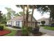 Well-kept exterior, showcasing landscaping, driveway, and a two-car garage at 2360 Park Forest Blvd, Mount Dora, FL 32757