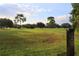 Peaceful golf course view with lush greenery and trees at 2360 Park Forest Blvd, Mount Dora, FL 32757