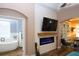 Main bedroom with a view of the bathroom and a fireplace at 2360 Park Forest Blvd, Mount Dora, FL 32757