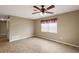 Bright living room with tile floors and ceiling fan at 11712 Layton St, Leesburg, FL 34788