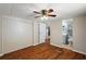 Bedroom with hardwood floors, closet and bathroom with vanity and toilet view at 1605 W Schwartz Blvd, The Villages, FL 32159