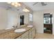 Bathroom featuring double sinks with granite countertop and ensuite access at 557 Dowling Cir, Lady Lake, FL 32159