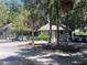 Exterior of bag drop with easy access to golf carts and bag drop sign visible at 557 Dowling Cir, Lady Lake, FL 32159