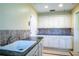 Spacious laundry room with ample counter and cabinet space at 557 Dowling Cir, Lady Lake, FL 32159