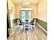 Formal dining area with a chandelier and white farmhouse table at 21945 King Henry Ave, Leesburg, FL 34748