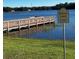 Scenic view of Royal Lake with a wooden dock and a sign indicating catch and release only at 21945 King Henry Ave, Leesburg, FL 34748