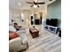 Spacious living room featuring light gray couch and wooden coffee table at 21945 King Henry Ave, Leesburg, FL 34748