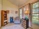 Inviting sun room with beadboard paneling, lots of natural light, and cozy furnishings at 21945 King Henry Ave, Leesburg, FL 34748