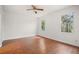 Bright bedroom with wood-look flooring and ceiling fan at 5008 Greenbriar Trl, Mount Dora, FL 32757