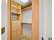 Bright walk-in closet with custom built shelving and drawers at 5008 Greenbriar Trl, Mount Dora, FL 32757