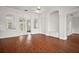 Bright living room with hard wood floors, architectural columns and detailed entryways at 5008 Greenbriar Trl, Mount Dora, FL 32757