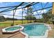 Relaxing screened pool and spa with golf course view at 5008 Greenbriar Trl, Mount Dora, FL 32757