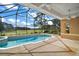 Screened pool and spa overlooking a golf course at 5008 Greenbriar Trl, Mount Dora, FL 32757