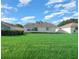 Large backyard with lush green grass at 9215 Sw 90Th St, Ocala, FL 34481