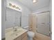 Bathroom includes a tub, shower, and updated flooring at 9215 Sw 90Th St, Ocala, FL 34481