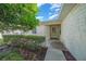 Front porch entrance with whitewashed brick and hedges at 9215 Sw 90Th St, Ocala, FL 34481