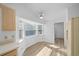 Kitchen with vinyl flooring, bay window, and ceiling fan at 9215 Sw 90Th St, Ocala, FL 34481