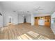 Bright living room with wood-look flooring and built-in shelving at 9215 Sw 90Th St, Ocala, FL 34481