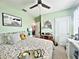 Bright bedroom featuring a floral comforter and farmhouse decor accents at 1771 Henin Cir, Tavares, FL 32778