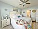 Inviting primary bedroom with a plush bed, soft lighting, and serene ambiance, ideal for restful nights and peaceful mornings at 1771 Henin Cir, Tavares, FL 32778