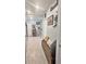 Light and airy hallway with bench seating and decorative wall decor at 1771 Henin Cir, Tavares, FL 32778