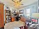 This home office features a built-in desk, shelving and nautical decor for a creative and productive workspace at 1771 Henin Cir, Tavares, FL 32778