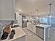 Spacious kitchen featuring a central island, stainless steel appliances, and open layout, ideal for culinary enthusiasts and gatherings at 1771 Henin Cir, Tavares, FL 32778