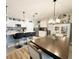 Charming kitchen featuring a center island, breakfast bar, and modern appliances, creating a functional and inviting culinary space at 1771 Henin Cir, Tavares, FL 32778