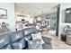 Open-concept living area seamlessly connects the living room, kitchen, and dining space, perfect for modern living and entertaining at 1771 Henin Cir, Tavares, FL 32778