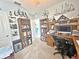 Comfortable home office with built-in bookshelves, a desk, a computer, and nautical decor at 1771 Henin Cir, Tavares, FL 32778
