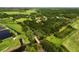 The property is nestled among lush trees and open fields in a serene location at 26012 Splendid Meadow Ct, Astatula, FL 34705