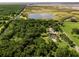 An aerial shot showcases the property's proximity to conservation areas, ponds and meticulously landscaped grounds at 26012 Splendid Meadow Ct, Astatula, FL 34705