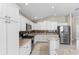 Spacious kitchen featuring granite countertops and stainless steel appliances at 2968 Wotring Way, The Villages, FL 32163