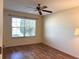 Bedroom with hardwood floors, a ceiling fan and window blinds at 9400 Se 176Th Saffold St, The Villages, FL 32162